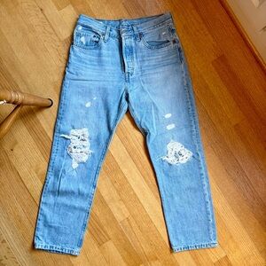 Distressed Levi’s 501 blue jeans